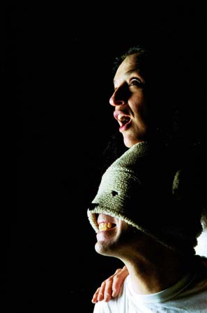 the girl rides on the bear's back